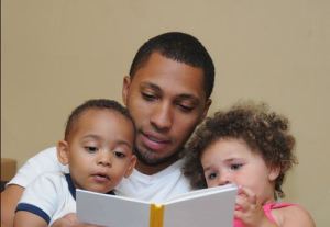 Dad reading to kids